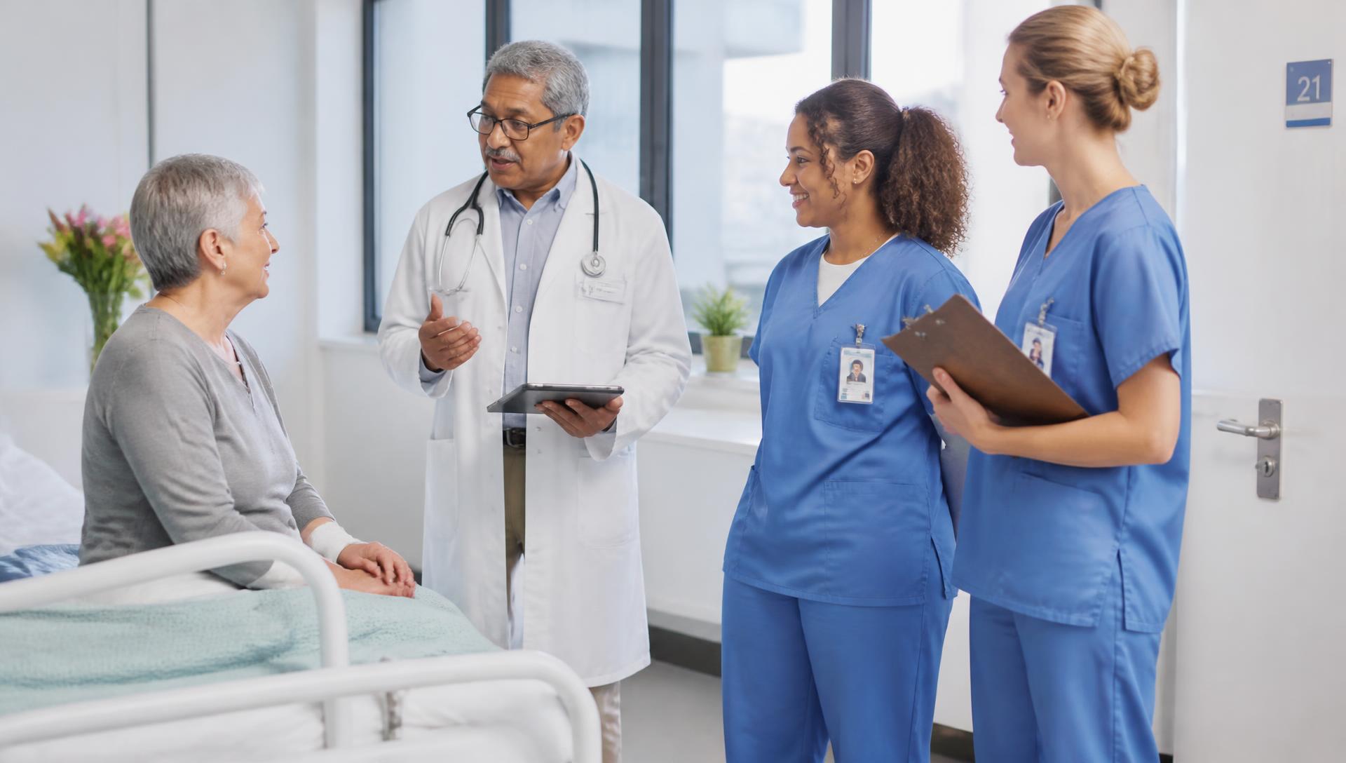 Physician and nurses on a ward round with a patient
